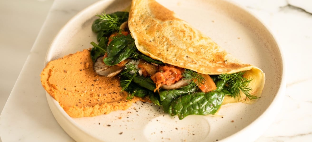 omelette with vegetables inside on a plate